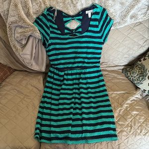 Cute teal and navy blue short sleeve dress with two bows on the back